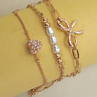 JOSSLYN by Wall to Wall Charm Bracelet-Multi Layer Bow Pearl Heart Charms