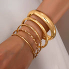 JOSSLYN by Wall to Wall Gold Textured Bangle Stack Set by JOSSLYN by Wall to Wall