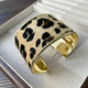 YAZ. Animalistic Metal Hide Open Bracelet by YAZ.