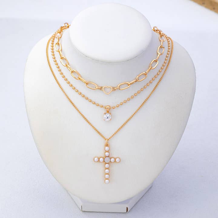 JOSSLYN by Wall to Wall Multi-Layered Pearl Cross Rhinestone Necklace | 80N93577 by JOSSLYN by Wall to Wall