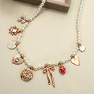 JOSSLYN by Wall to Wall Pearl Beaded Bow Strawberry Cherry Necklace